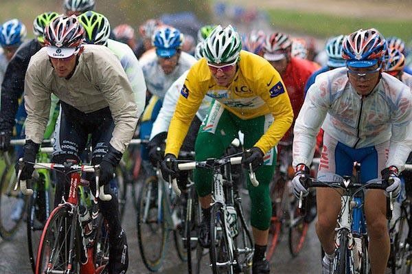 Fr&auml;nk Schleck (Team CSC), Thor Hushovd (Cr&eacute;dit Agricole) and Fumiyuki Beppu (Skil-Shimano) from left to right, are out of the saddle as they battle the rain drops and the slope.