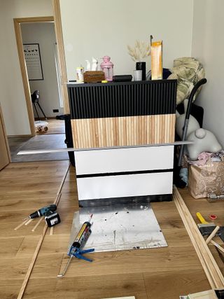 Ikea malm drawers in process of adding moulding and paint