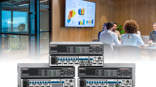 The Extron scaling switchers super imposed in front of a conference room presentation. 