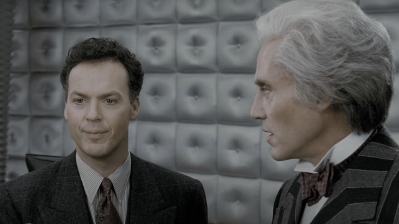 Michael Keaton as Bruce Wayne standing next to Christopher Walken as Max Schreck in Batman Returns