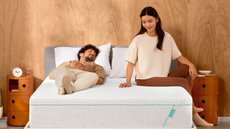 Couple lying down on mattress