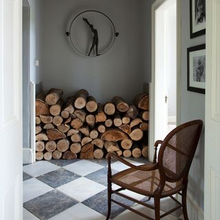 hallway with firewood and armchair