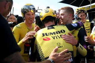 Jumbo-Visma’s Amund Jansen (centre) – with his number-23 squad number visible at the back of the neck of his skinsuit – celebrates winning the stage 2 team time trial and defending teammate Mike Teunissen’s yellow leader’s jersey at the 2019 Tour de France