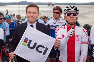 New UCI president David Lappartient with 2014 Worlds winner Michał Kwiatkowski on the start line