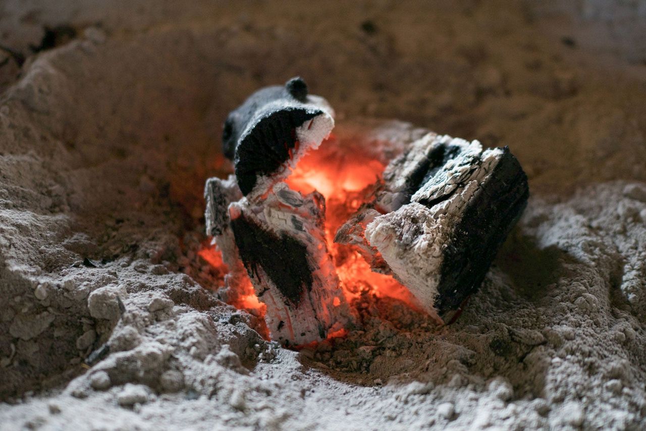 Small Piece of Charcoal Burning into Ash