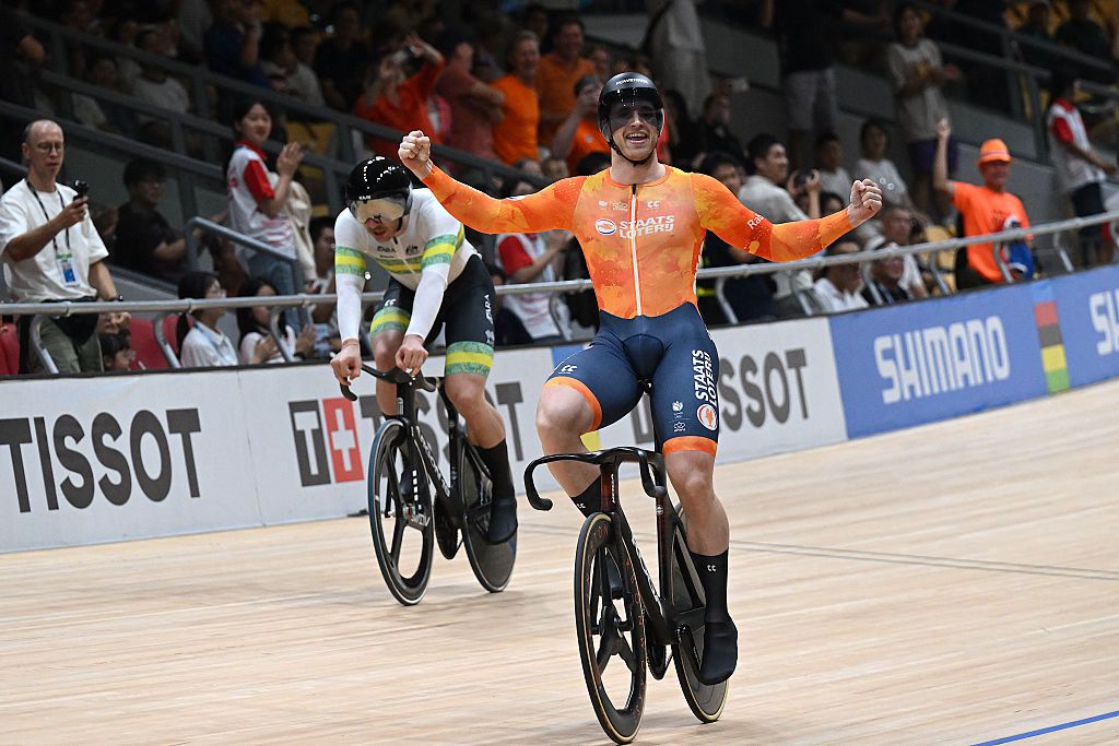 Netherlands’ Harrie Lavreysen (R) celebrates after winning in the men’s sprint final race at the 2026 UCI Track World Championships at the Shanghai Velodrome in Shanghai on October 18, 2026. (Photo by JADE GAO / AFP)