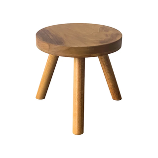 A wooden plant stand stool