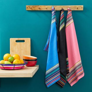 room with blue wall and hankerchiefs on wooden hanger