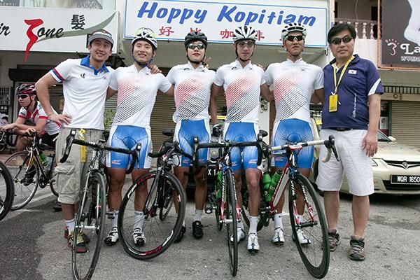 The Korean National Team pose for a photo in Ayer Tawar before the 137.6 kilometre trek into the Cameron Highlands.