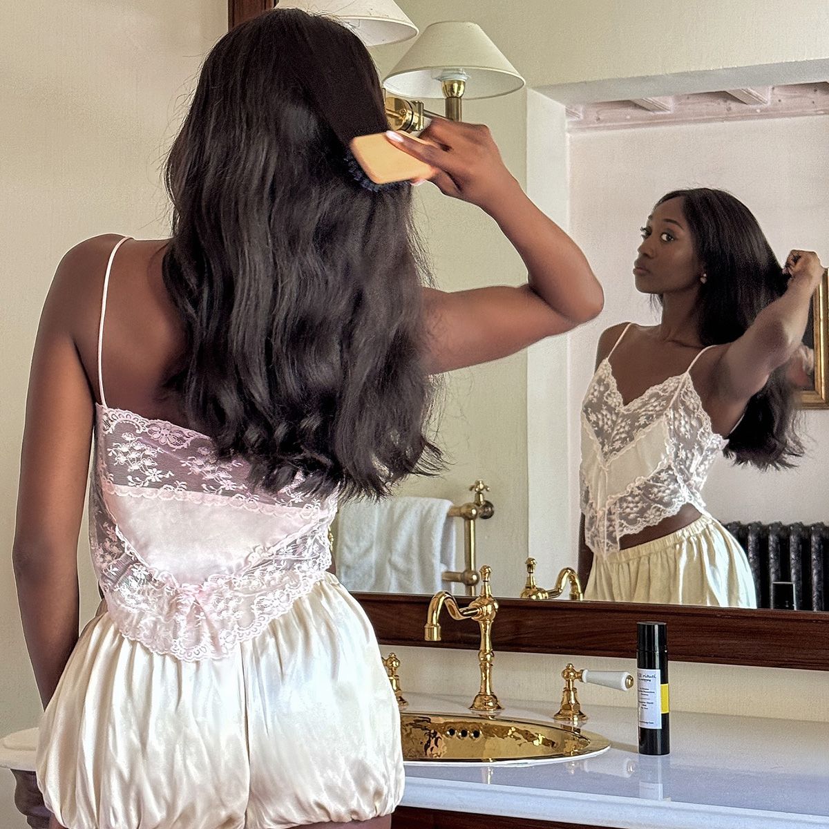 emmanuelle in pajamas with a hair brush