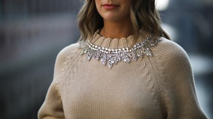 woman wearing a crystal embellished sweater
