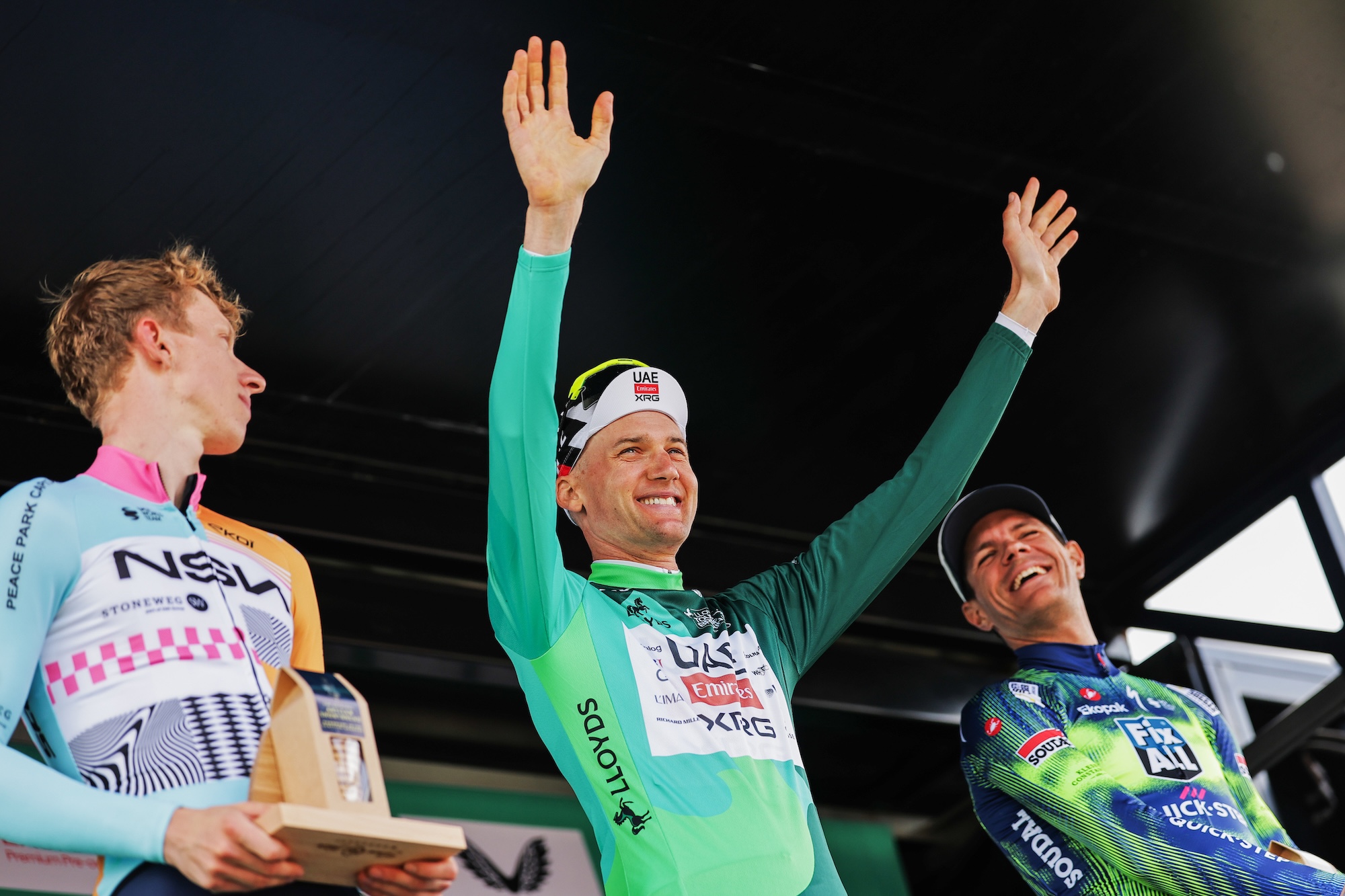 Tim Wellens celebrates overall title of 2026 Tour of Britain Men, with Lewis Askey (NSN Cycling Team) second and Jasper Stuyven (Soudal-QuickStep) third