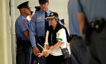 A woman is arrested during a "Moral Monday" protest