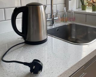 An unplugged electric kettle in kitchen