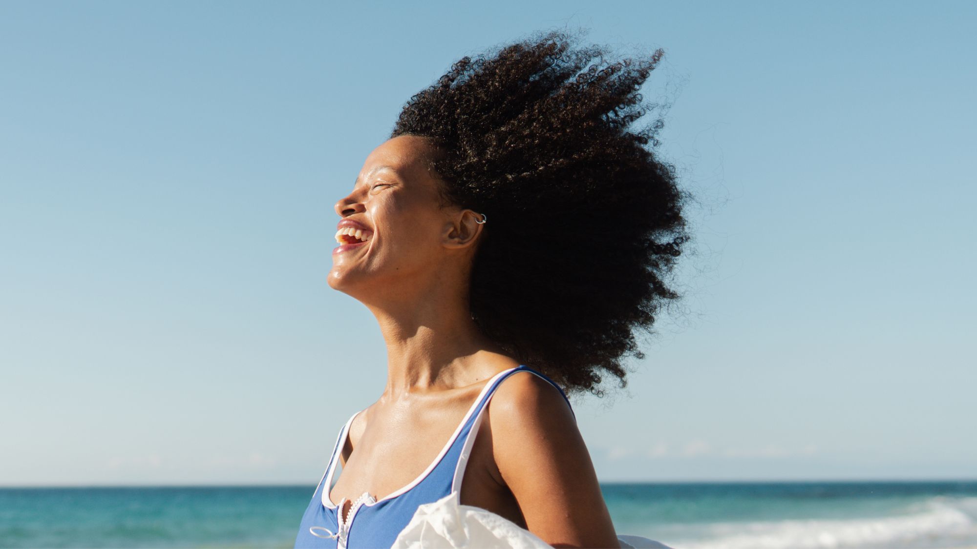Portrait of a beautiful, smiling African American woman on the beach