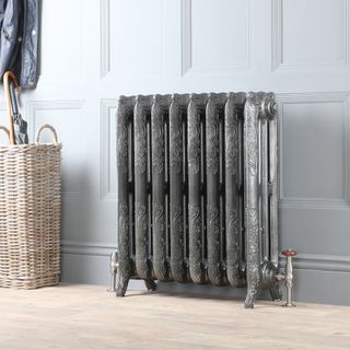Cast iron grey silver radiator with ornate pattern