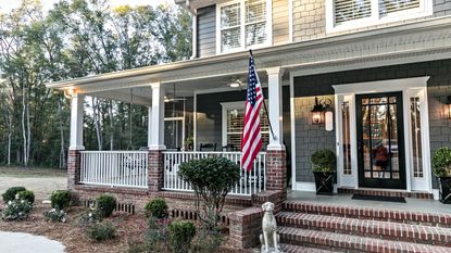 Flag code rules: American flag hung outside house 