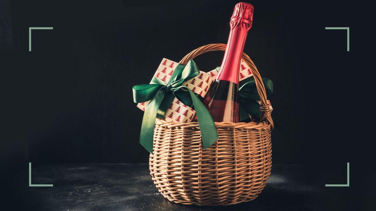 a gift hamper with wine and presents inside