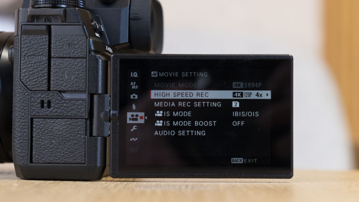 The Fujifilm X-H2S camera on a wooden table