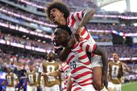 LOS ANGELES, CALIFORNIA - JUNE 12: Folarin Balogun #20 of the United States celebrates with teammates after scoring the team's third goal during the FIFA World Cup 2026 Group D match between USA and Paraguay at Los Angeles Stadium on June 12, 2026 in Los Angeles, California. (Photo by John Dorton/USSF/Getty Images)