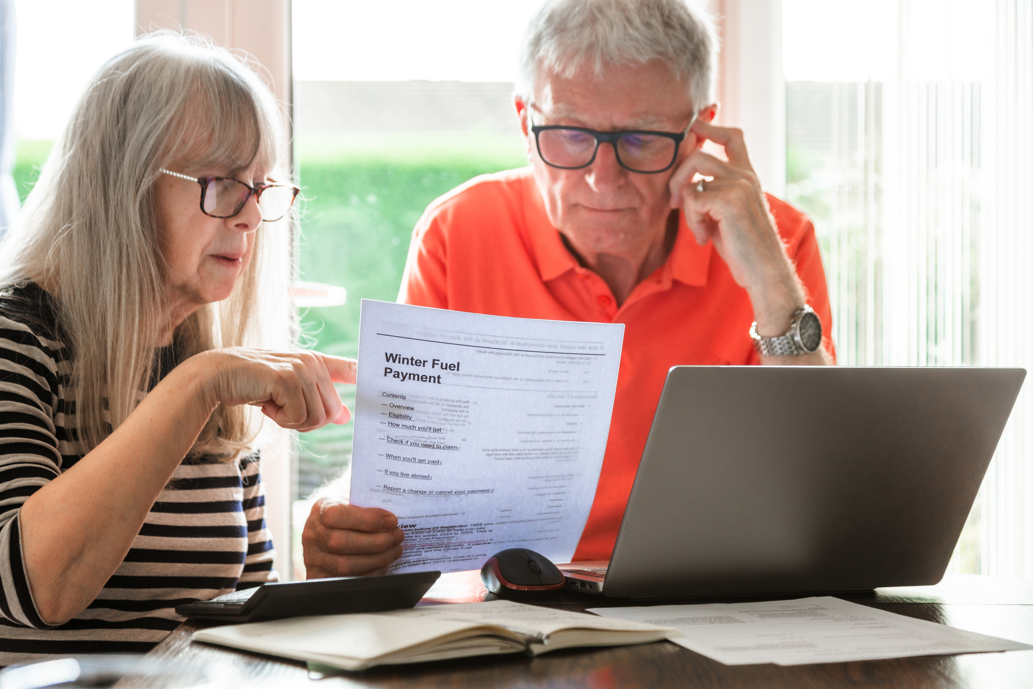 Older couple looking at their energy bill