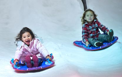 Young children enjoy the rides in Penny's Snow Place at Winterfest, southern California's newest wintertime experience
