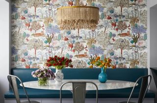 dining area with floral mural on the walls