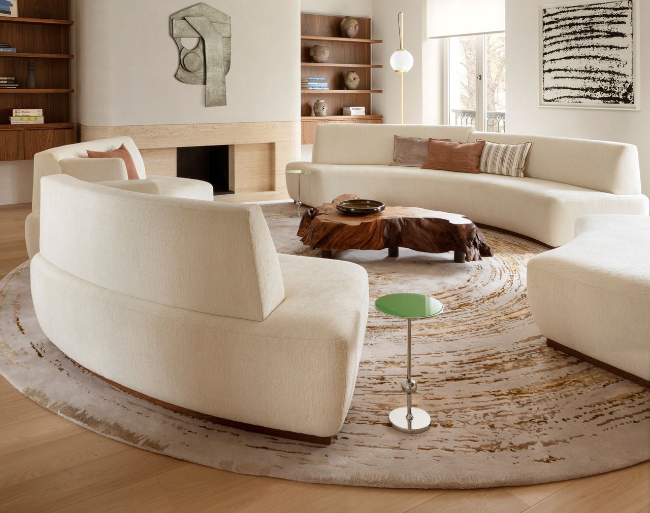 A round rug with a round curved sofa