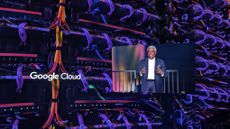A photo of the Google Cloud logo on a screen at the Sphere in Las Vegas, next to another video feed showing Thomas Kurian, CEO at Google Cloud overlaid on top of a macro shot of a server rack in a Google data center.
