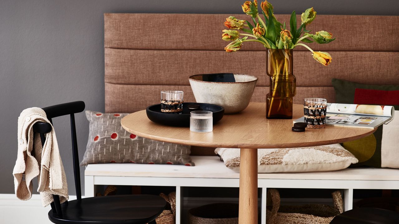 Simple bench seating built against wall in dining room