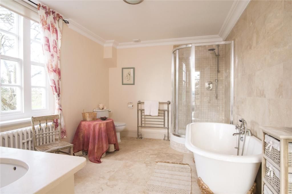 A bathroom in the property with large bath and shower