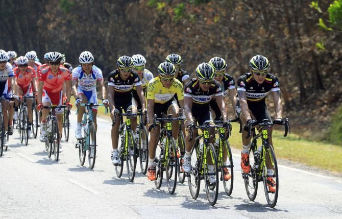 The Colombia team drive the peloton
