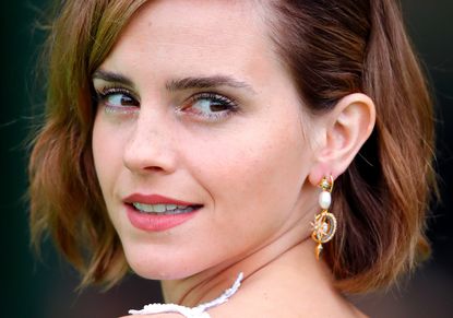 Emma Watson posing on the red carpet.