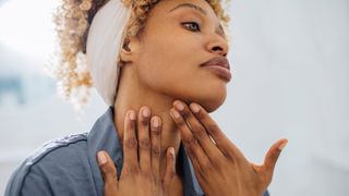 woman applying makeup