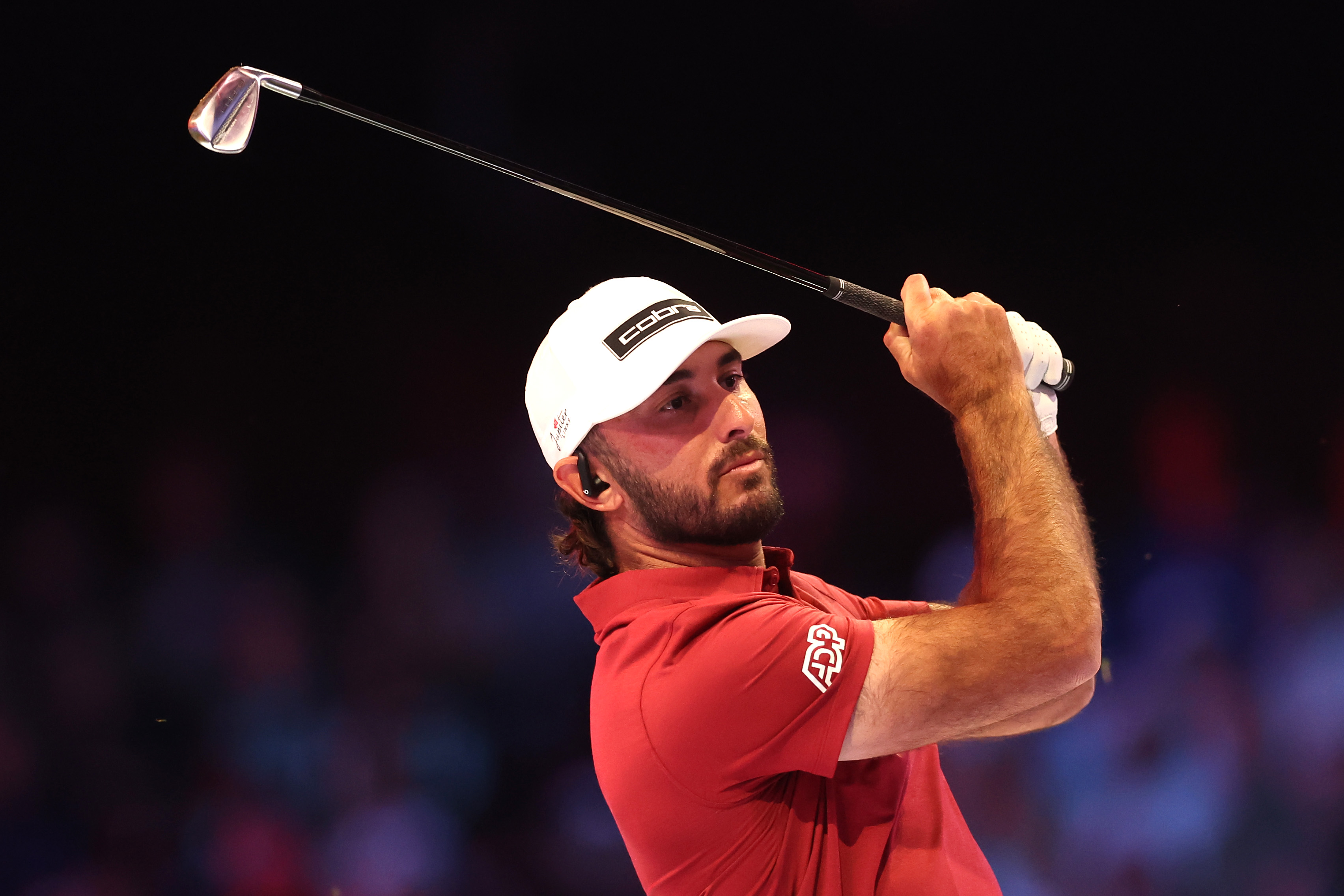 Max Homa hits an iron shot at TGL