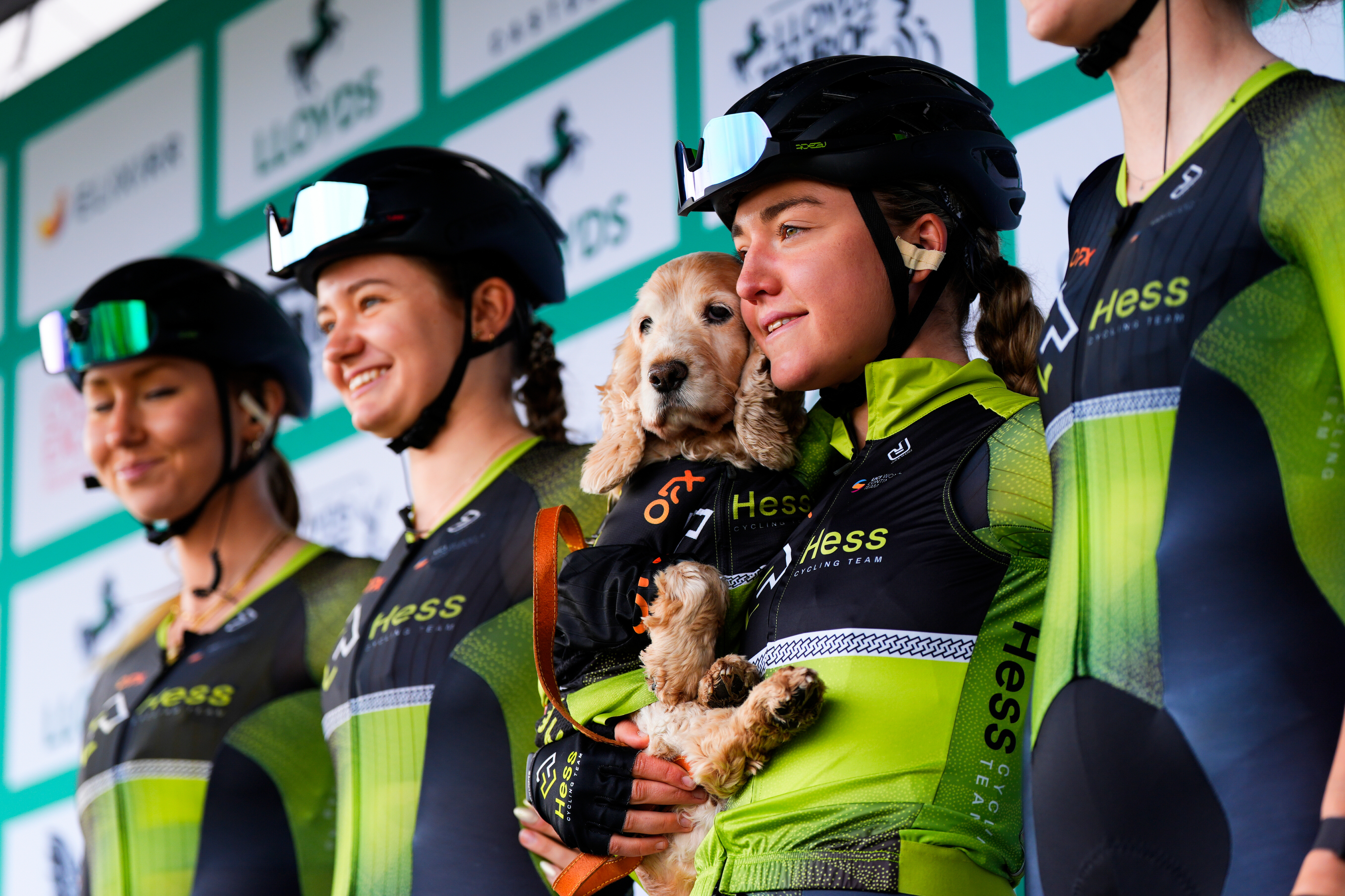 Grace Lister with her dog Molly and team-mates at Tour of Britain 2025