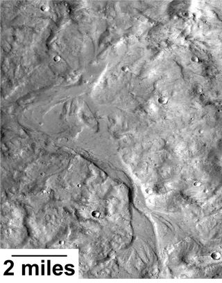 Streamlined forms in this Martian valley resulted from the outflow of a lake hundreds of millions years more recently than an era of Martian lakes previously confirmed.