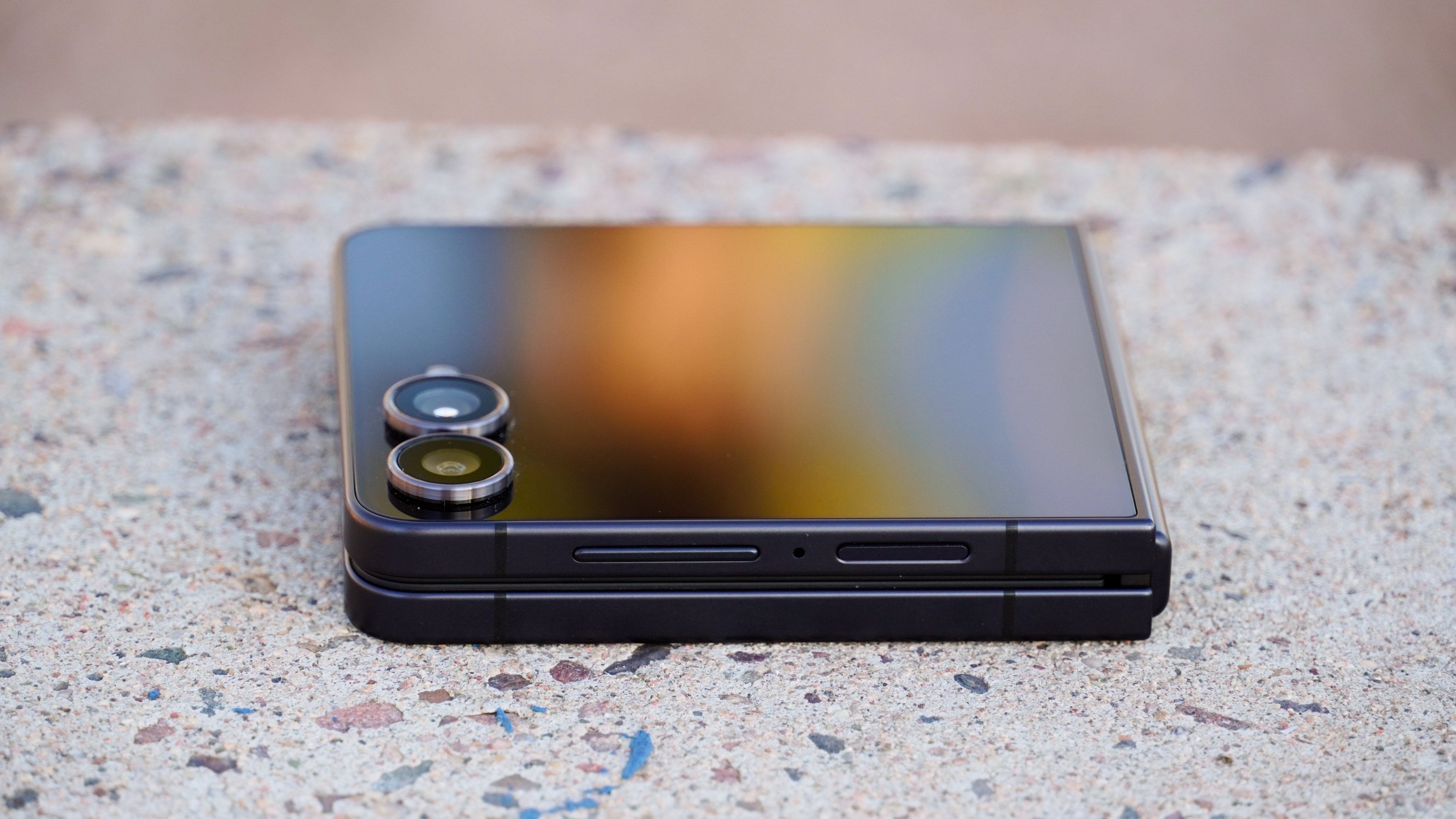 The Samsung Galaxy Z Flip 7 closed on its side.
