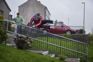 Billy and Conor being chased by an angry mob.