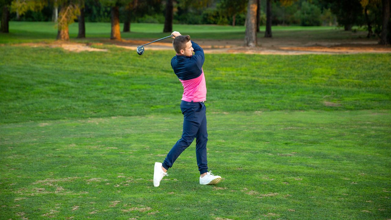 PGA pro Alex Elliott hitting a fairway wood at Infinitum Golf Resort in Spain