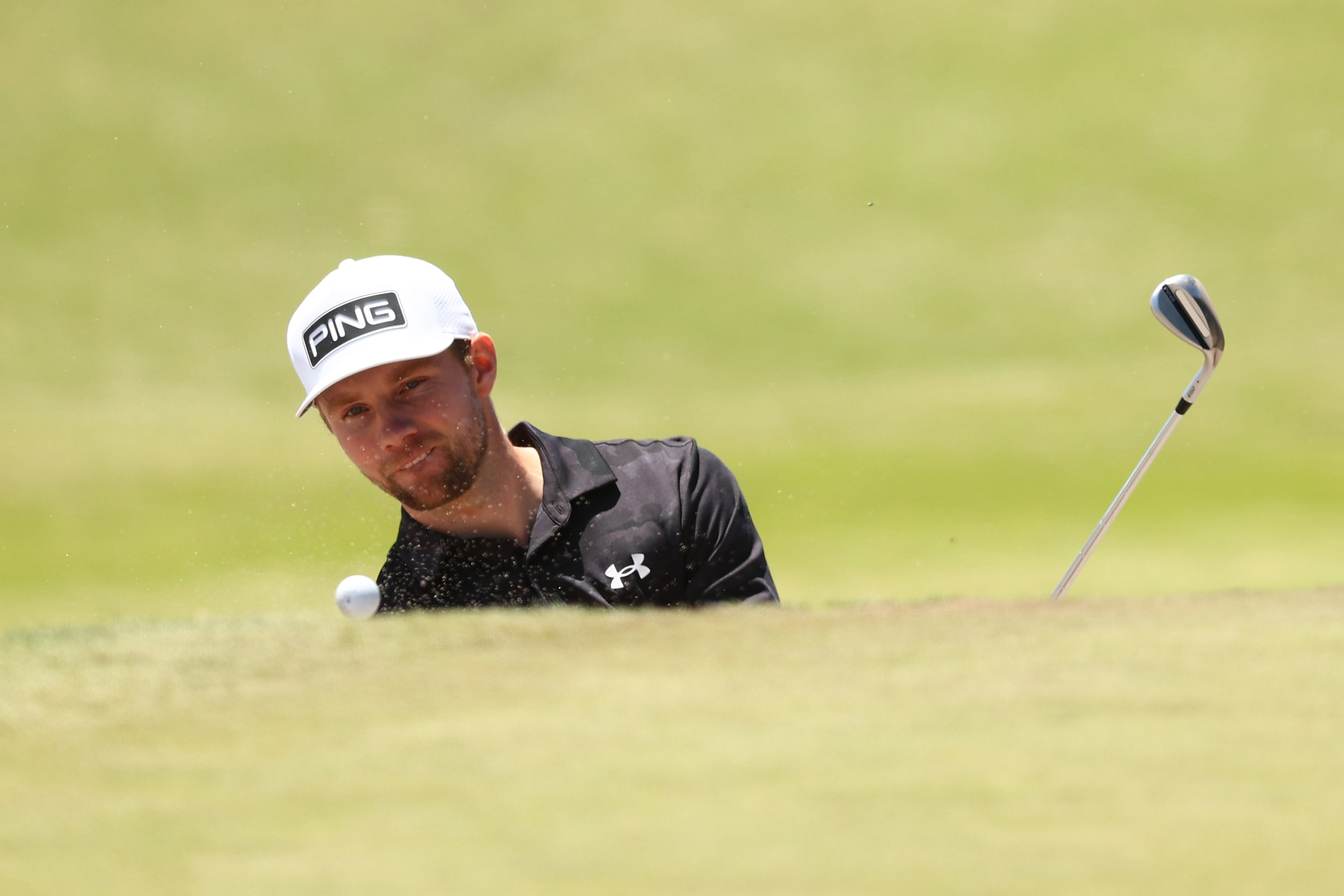 Rasmus Neergaard-Petersen hits a bunker shot