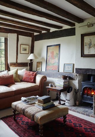 beamed cottage with sofas and fireplace