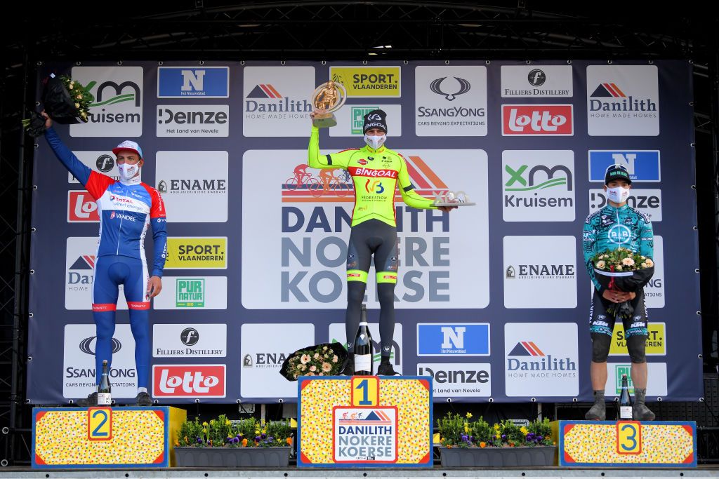 NOKERE BELGIUM MARCH 17 Podium Damien Gaudin of France and Team Total Direct Energie Ludovic Robeet of Belgium and Team Bingoal WB Luca Mozzato of Italy and Team BB Hotels PB KTM Celebration during the 75th Nokere Koerse Danilith Classic 2021 Mens Elite a 1955km race from Deinze to Nokere Mask Covid safety measures Flowers NokereKoerse on March 17 2021 in Nokere Belgium Photo by Luc ClaessenGetty Images