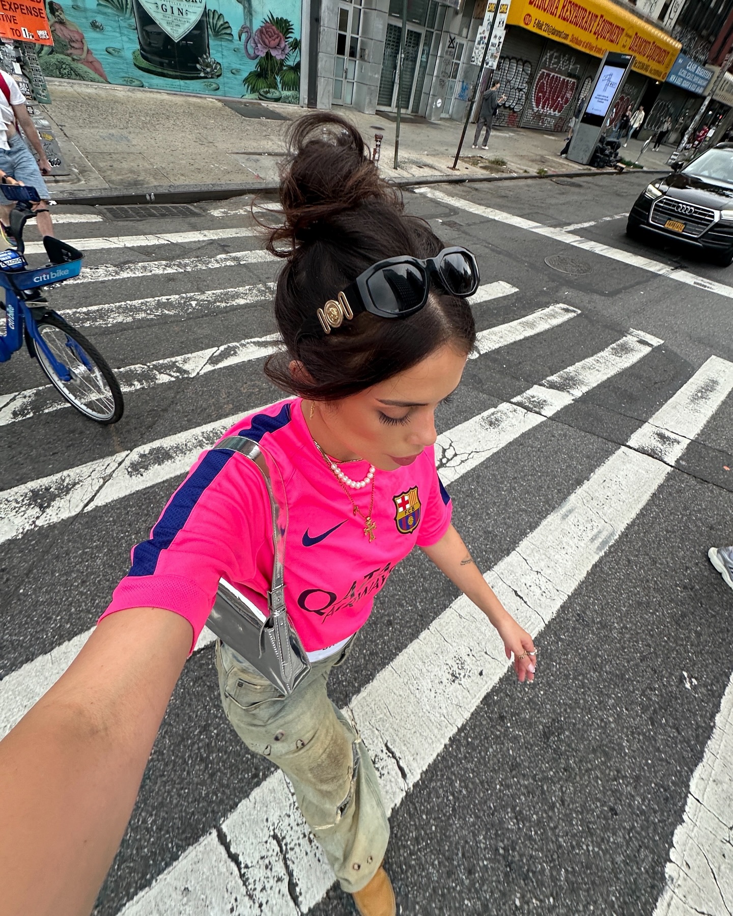 Girl posing wearing a football jersey