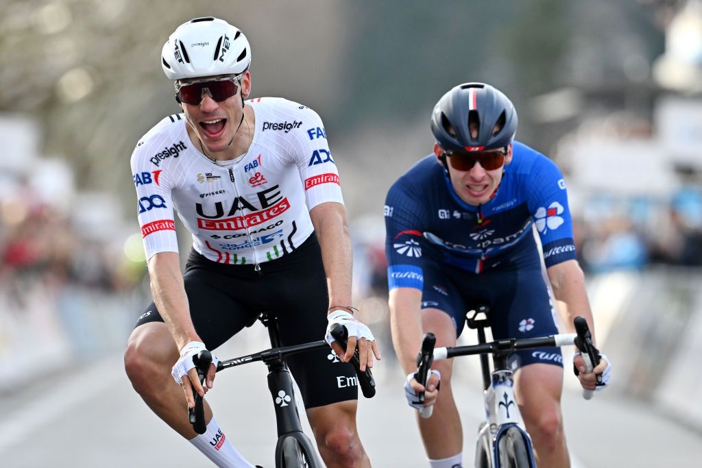 GUILHERANDGRANGES FRANCE FEBRUARY 24 LR Juan Ayuso of Spain and UAE Team Emirates celebrates at finish line as race winner ahead of Romain Gregoire of France and Team Groupama FDJ during the 4th FaunArdche Classic 2024 a 1659km one day race from GuilherandGranges to GuilherandGranges on February 24 2024 in GuilherandGranges France Photo by Billy CeustersGetty Images