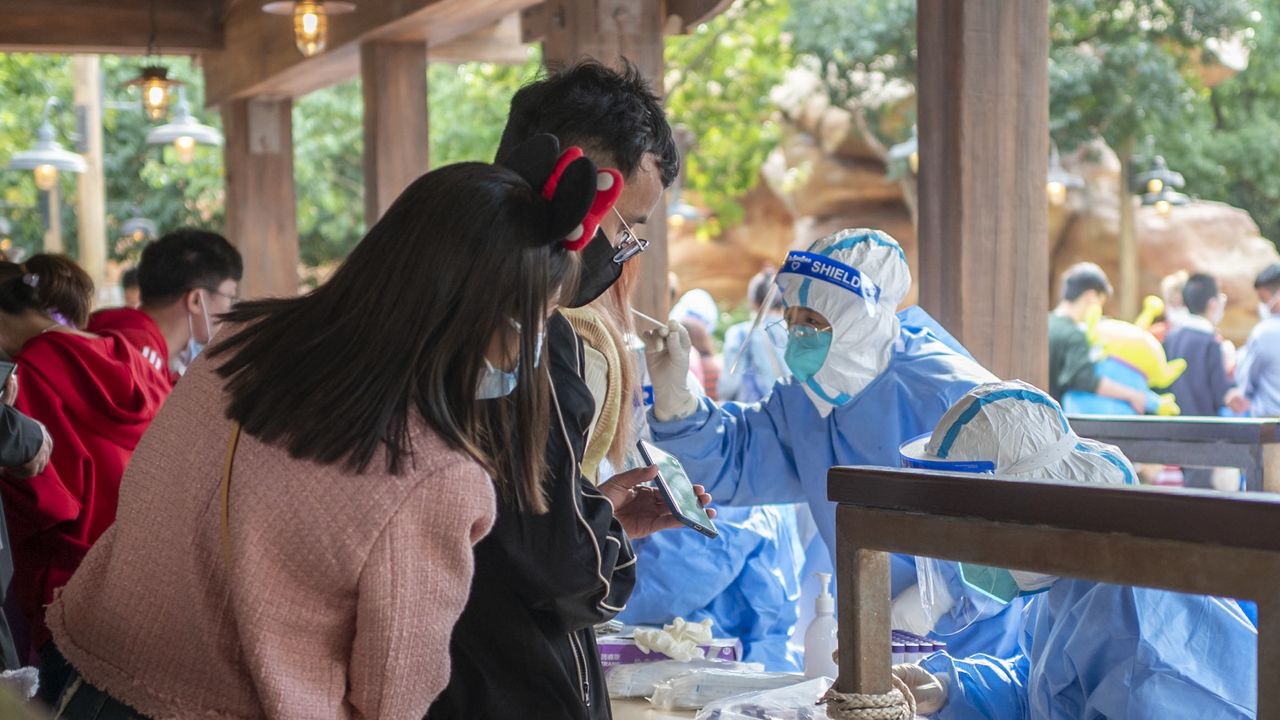 Disney visitors await a Covid test