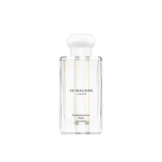 Jo Malone London Special-Edition Pomegranate Noir Cologne in white striped Christmas packaging is one of the best Christmas beauty gifts for her.