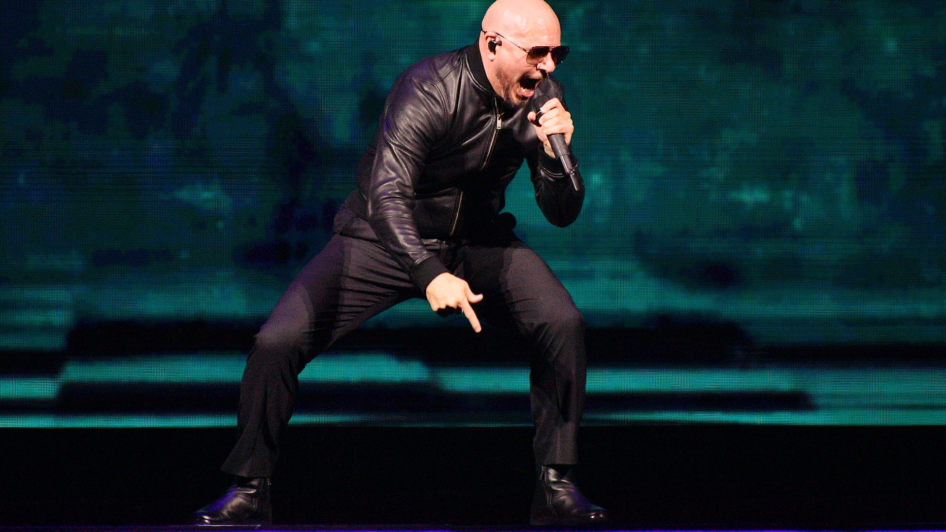 Pitbull performing on stage in London 