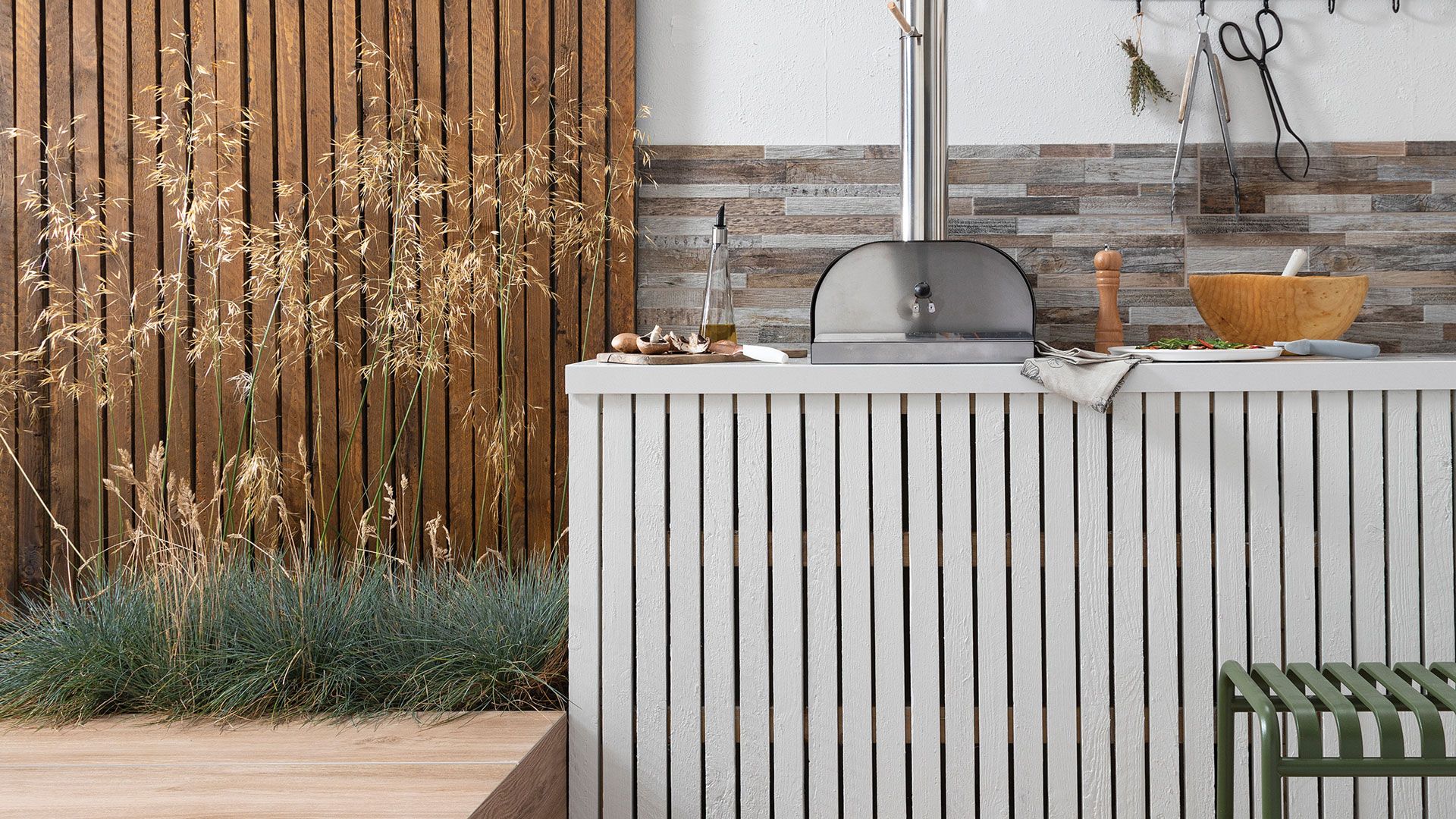 contemporary outdoor kitchen with white stone worktops