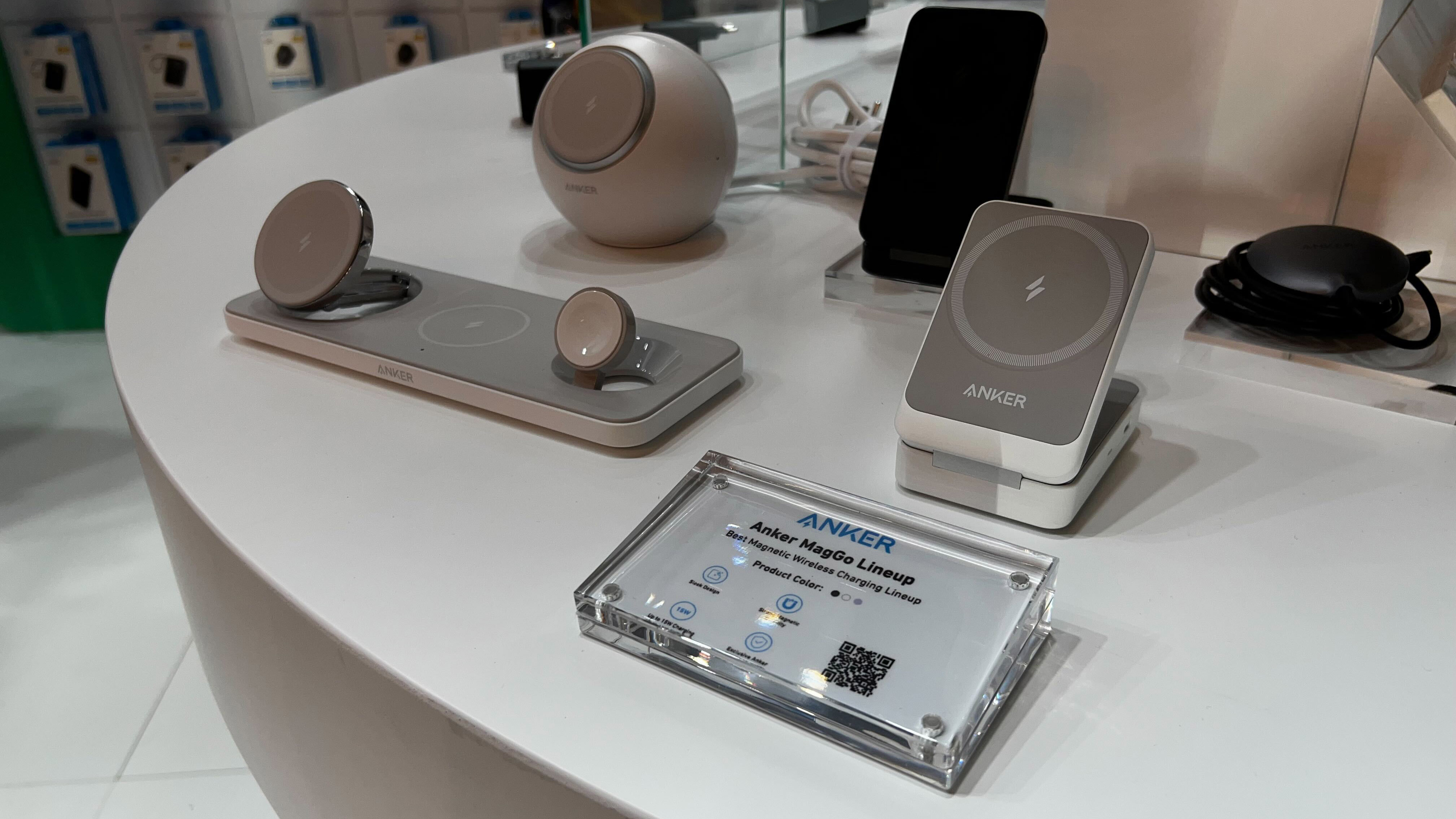 An Anker MagGo charger sitting on a glass table